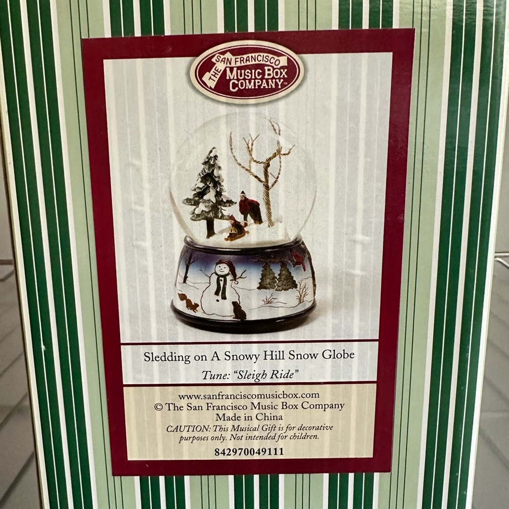 San Francisco Music Box Company - “Sledding in a Snowy Hill Snow Globe.